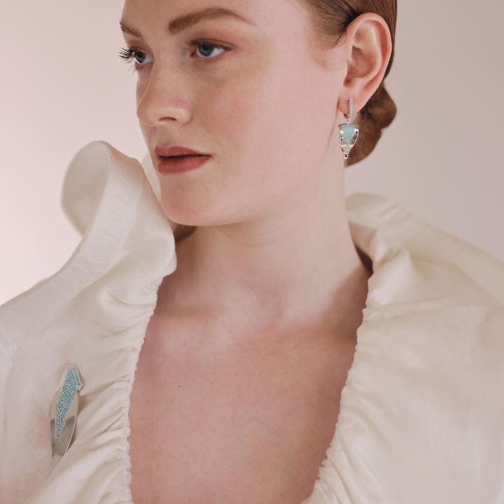 Echo silver huggie earrings with blue CZ stones