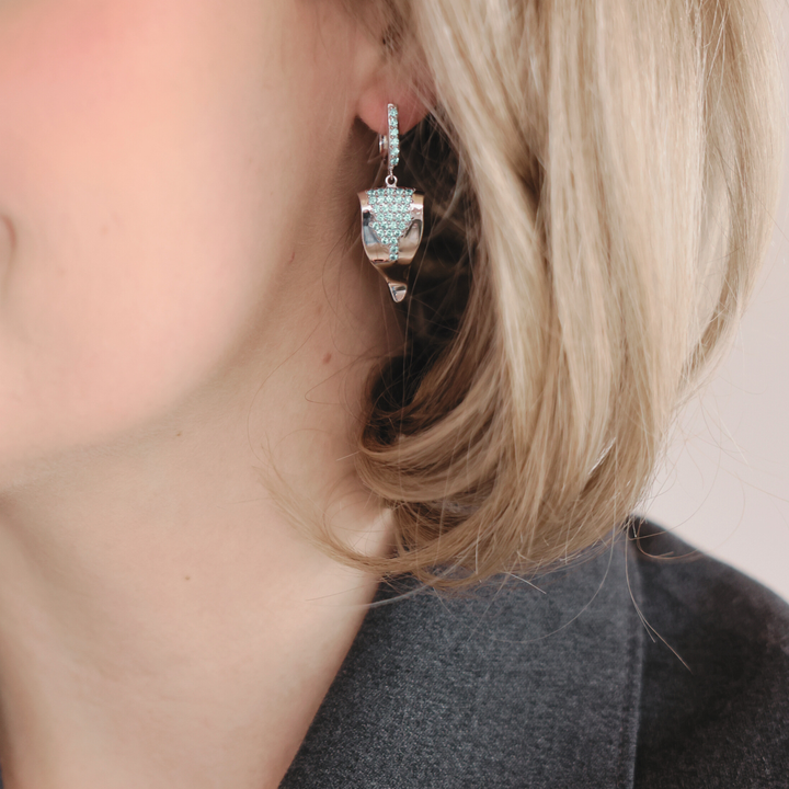 Echo silver huggie earrings with blue CZ stones