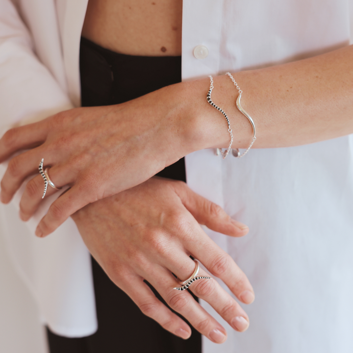 Swirl silver bracelet with onyx cz