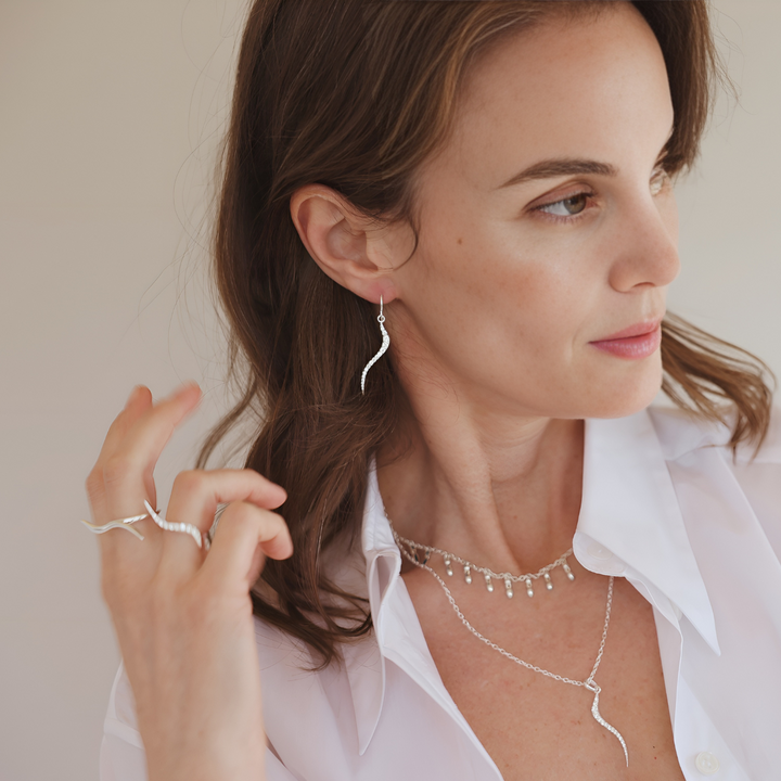 Swirl silver earrings with clear cz