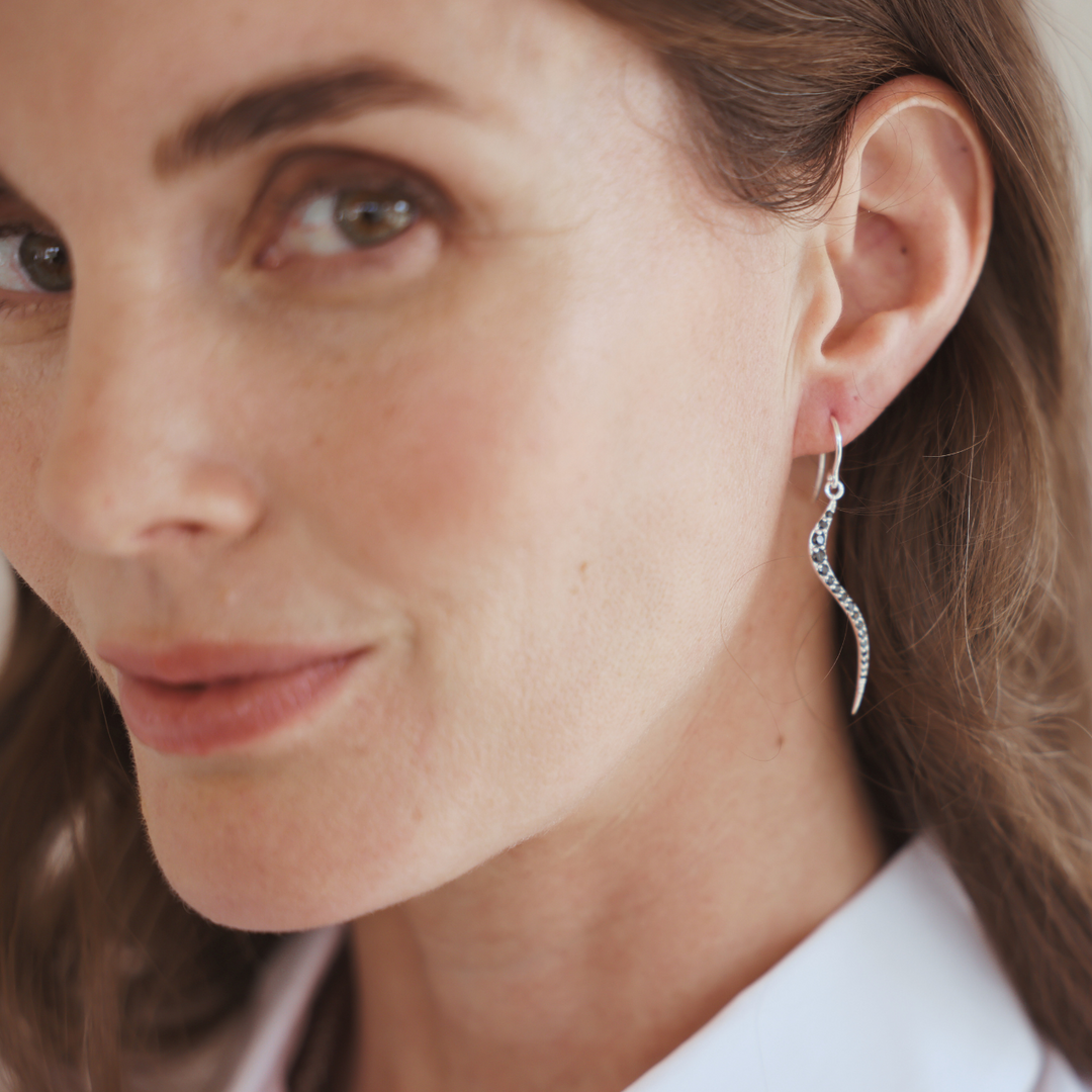 Swirl silver earrings with black onyx cz