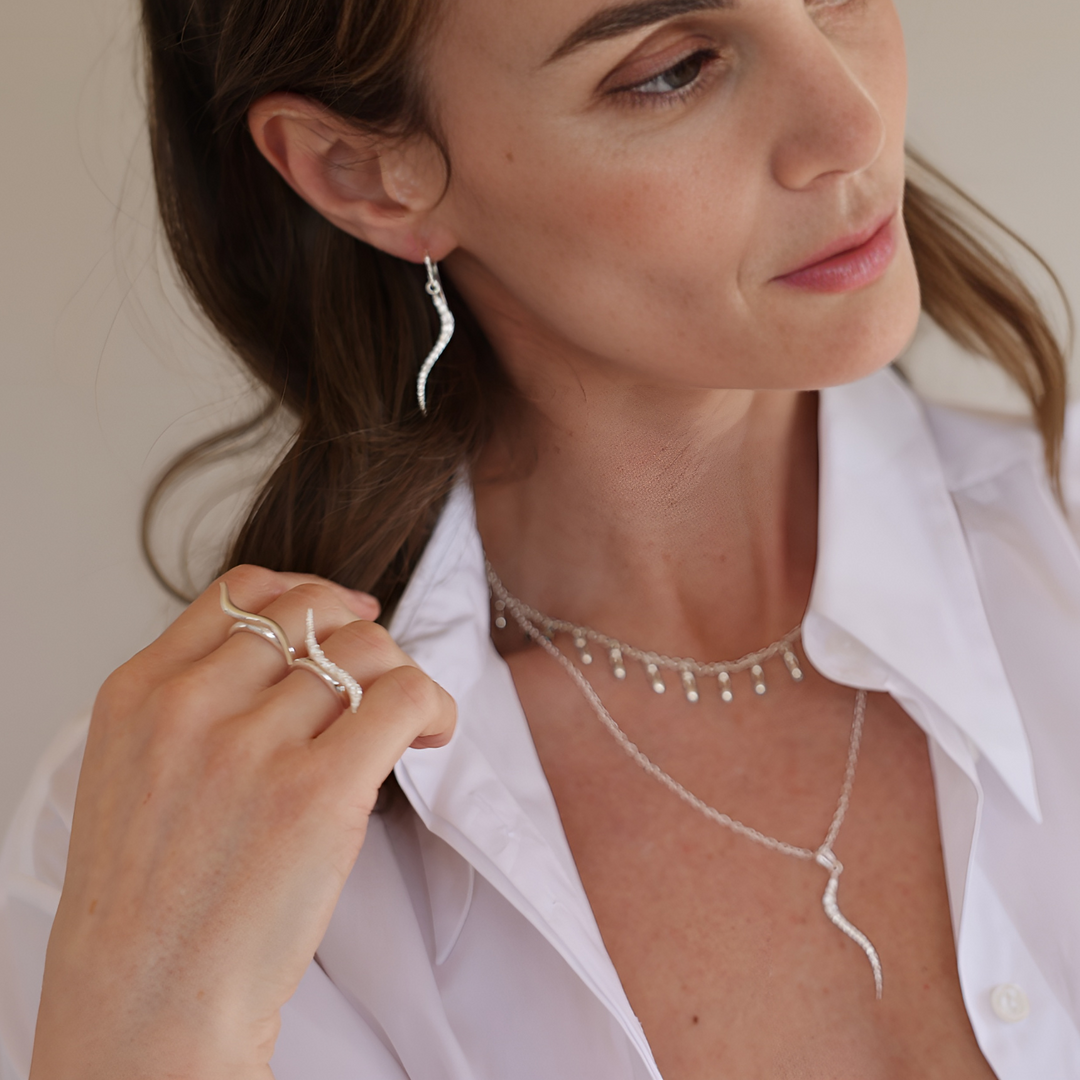 Swirl silver ring with clear cz's